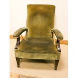 A Georgian mahogany framed elbow chair upholstered in green material