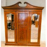 Edwardian inlaid mahogany three door wardrobe with double mirrored doors,