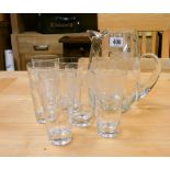 A set of six decorative cut glass drinking glasses and a lemonade jug