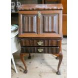 A mahogany bureau with shaped forefront, two drawers under,