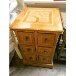 A modern oak and parquetry style chest of six small drawers,