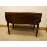 A Victorian mahogany Pembroke table fitted one drawer on reeded style legs,