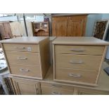 A pair of light beech three drawer bedside chests matching the previous sideboard