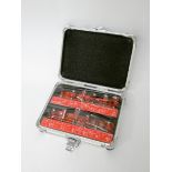 A 12 piece tungsten router bit set in aluminium carrying case