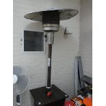 A Calor Gas patio heater rattan surround and shelf