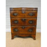 A Georgian style mahogany cross banded serpentine front bachelors chest,