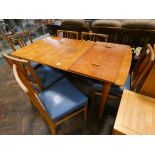 A 1970's Gordon Russell teak dining room suite comprising 4'9 dining table with centre leaf,