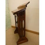 A Gothic style carved oak lectern,