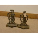 A pair of decorative Victorian brass fire dogs