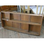 An Ercol elm wall plate rack