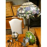 A Tiffany style table lamp with butterfly and floral shade,