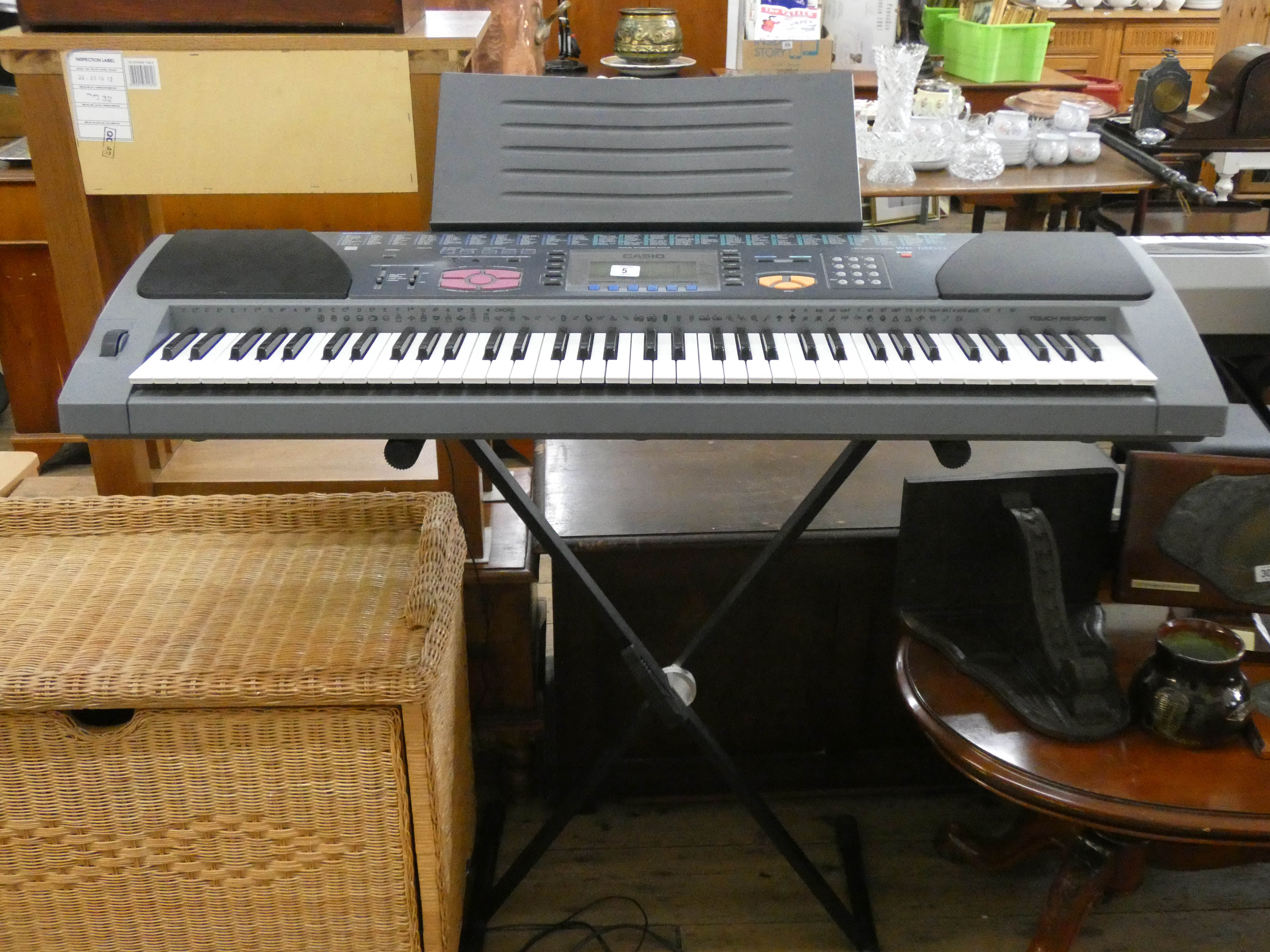 A Casio WK/1200 keyboard on stand