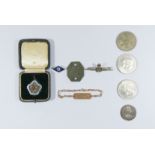 A group of collectibles to include two RAF badges, a WAAF identity bracelet, a WAAF dog tag,