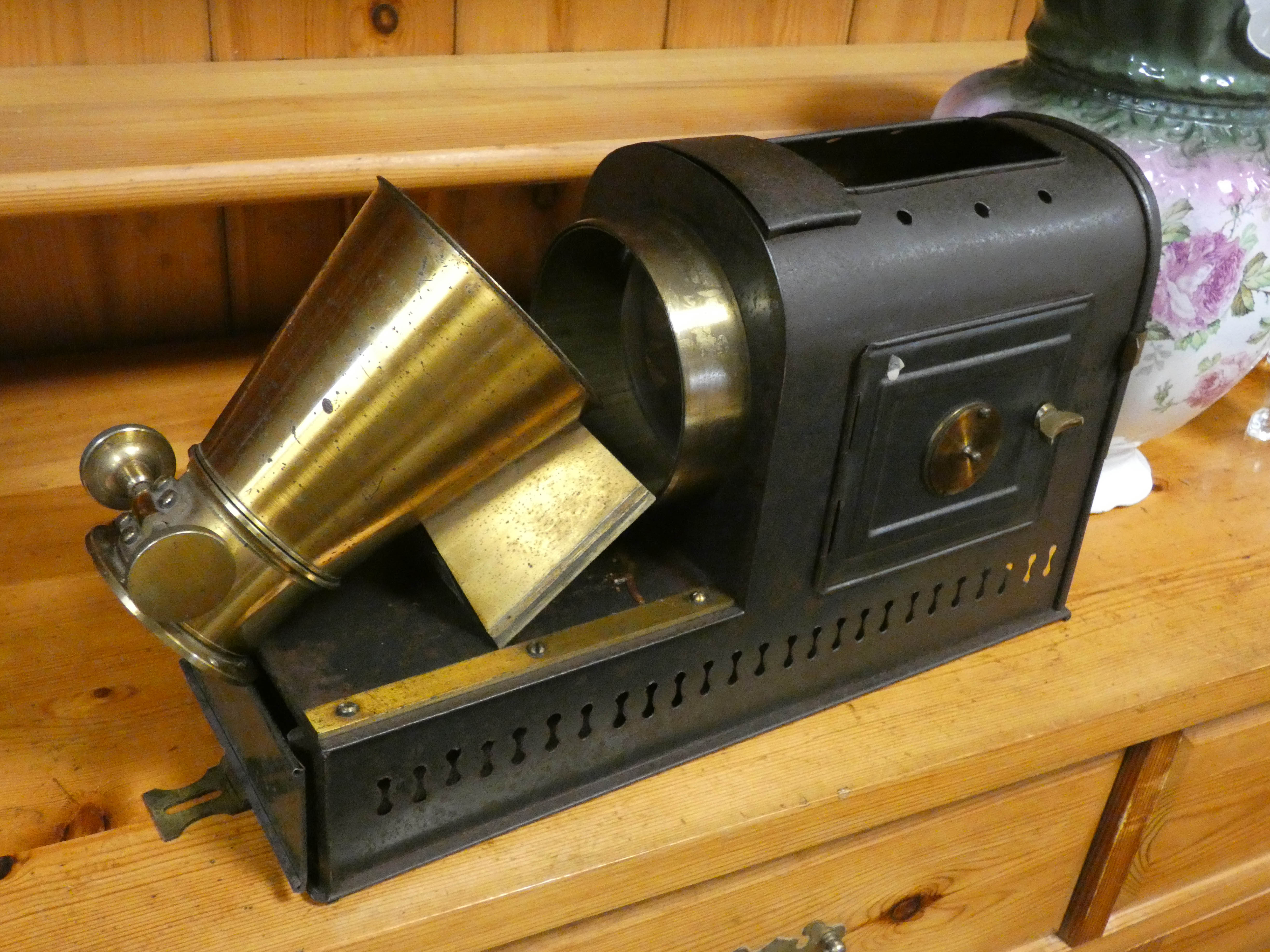 An old magic lantern in metal case