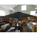 A new wind up garden parasol with heavy stabilising base and black cover