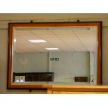 A bevelled wall mirror in mahogany frame