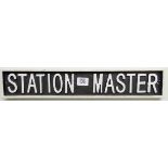 A Stationmaster cast iron wall hanging sign