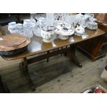 An Ercol oak refectory style dining table 5' x 2'8