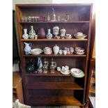 A stained mahogany finished open bookcase with adjustable shelves