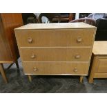 A light oak chest of three long drawers,