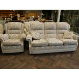 A three seater settee in cream and fawn patterned material with loose cushions and one matching