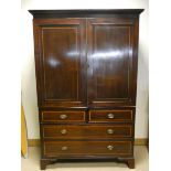 A Georgian inlaid mahogany linen press with four drawers under,