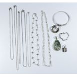 Collection of silver jewellery to include several chain necklaces, a bangle,