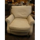 A modern easy chair in cream leather