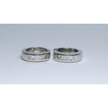 A pair of 14ct white gold and diamond hoop earrings,