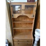 A pine kitchen dresser with glazed top and three long drawers under approx 32" wide