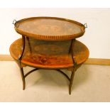 An Edwardian Sheraton Revival oval mahogany two tier tea table,