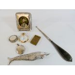 A portrait miniature of a Continental Count in a rectangle silver frame, articulated fish,
