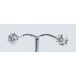 A pair of diamond solitaire studs set in 18ct white gold with a screw back, approximately 1.