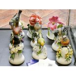 Nine various bird and floral decorated porcelain bells