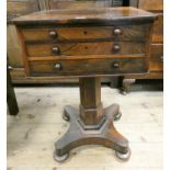 A Regency rosewood work table fitted three drawers standing on pillar and platform base,