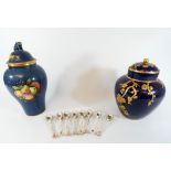 A set of eight Dresden porcelain coffee spoons and two Spode ginger jars and covers