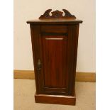 An Edwardian walnut pedestal cupboard