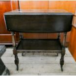 An Ercol dark oak two tier tea trolley