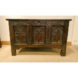 Alate 18th century carved oak coffer, front fitted with three highly carved panels,