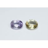 A collection of five ladies dress rings along with two loose gem stones of amethyst and citrine