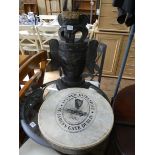 A carved wood native figure and an Irish hand held drum