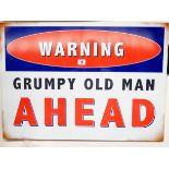 A metal wall hanging sign warning 'Grumpy Old Man Ahead',