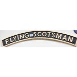 A cast iron arch shaped Flying Scots Man wall hanging sign,