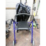 A fold up light weight push along mobility scooter and a four wheel zimmer frame with seat,