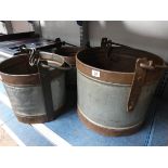 Three heavy milk buckets