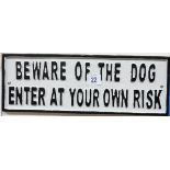 A cast iron wall hanging 'Beware of the Dog' sign,