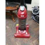 A red Vax upright carpet cleaner