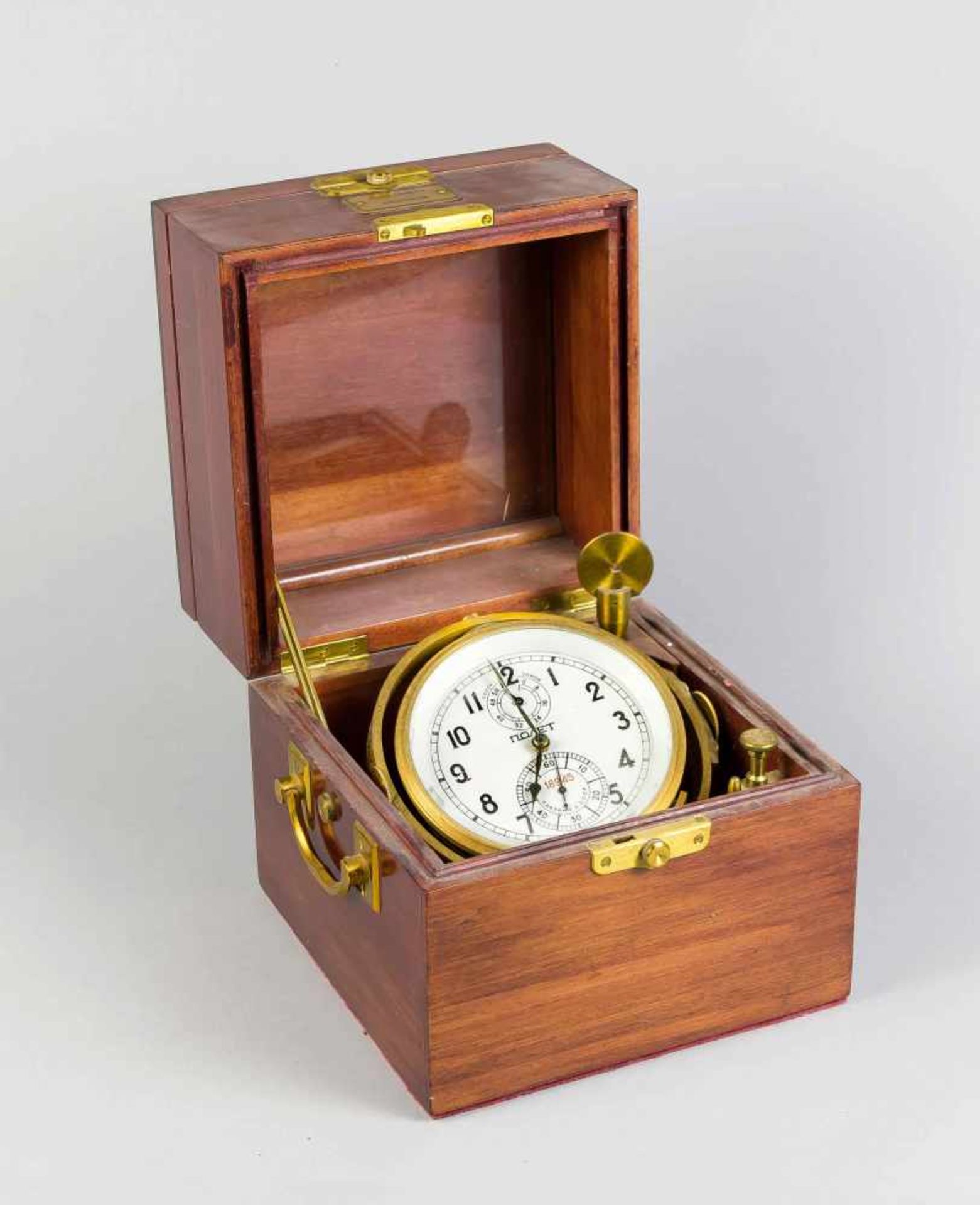 Marine-Chronometer. Russland, bez. Polet. 20. Jh. Doppelt klappbarer Holzkasten, seitl.Tragegriffe