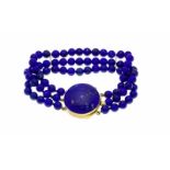 Lapislazuli-Armband GG 750/000 mit einem runden Lapislazuli-Cabochon 26 mm, 3-reihigLapislazuli-