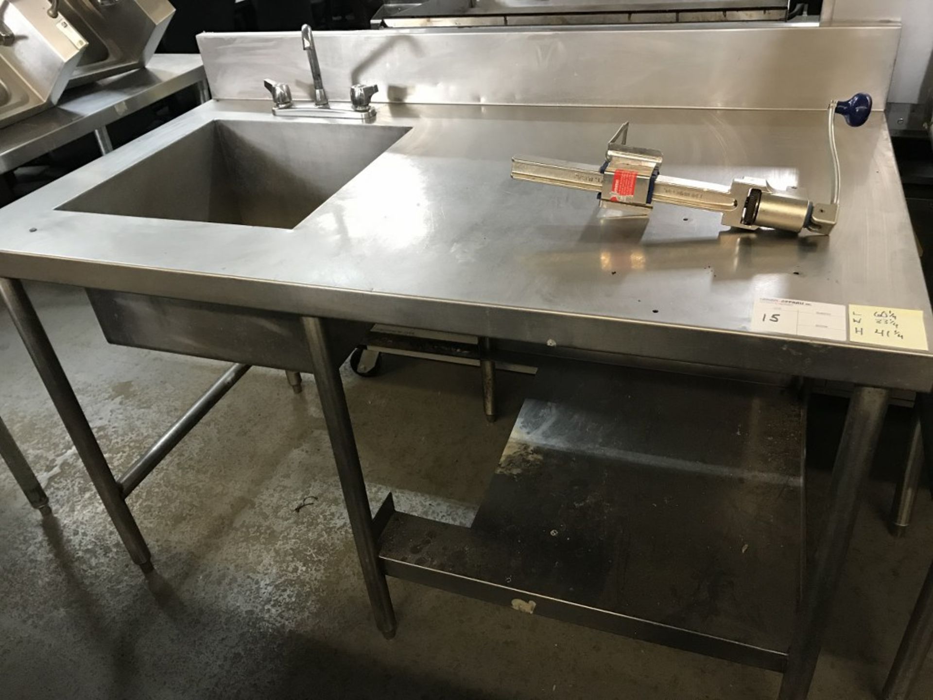 STAINLESS STEEL TABLE WITH SINK AND CAN OPENER. 60.25"L X 33.25W X 41.25H